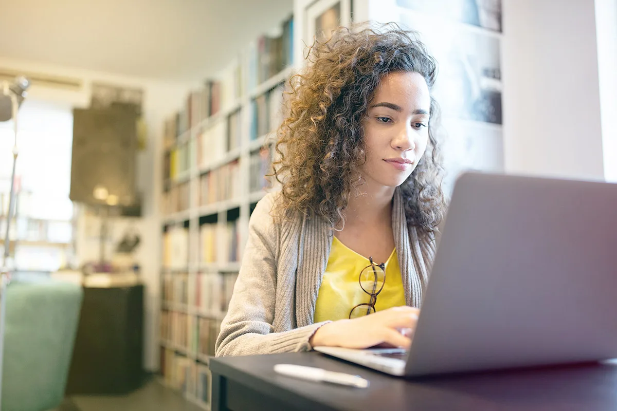 woman focusing at computer